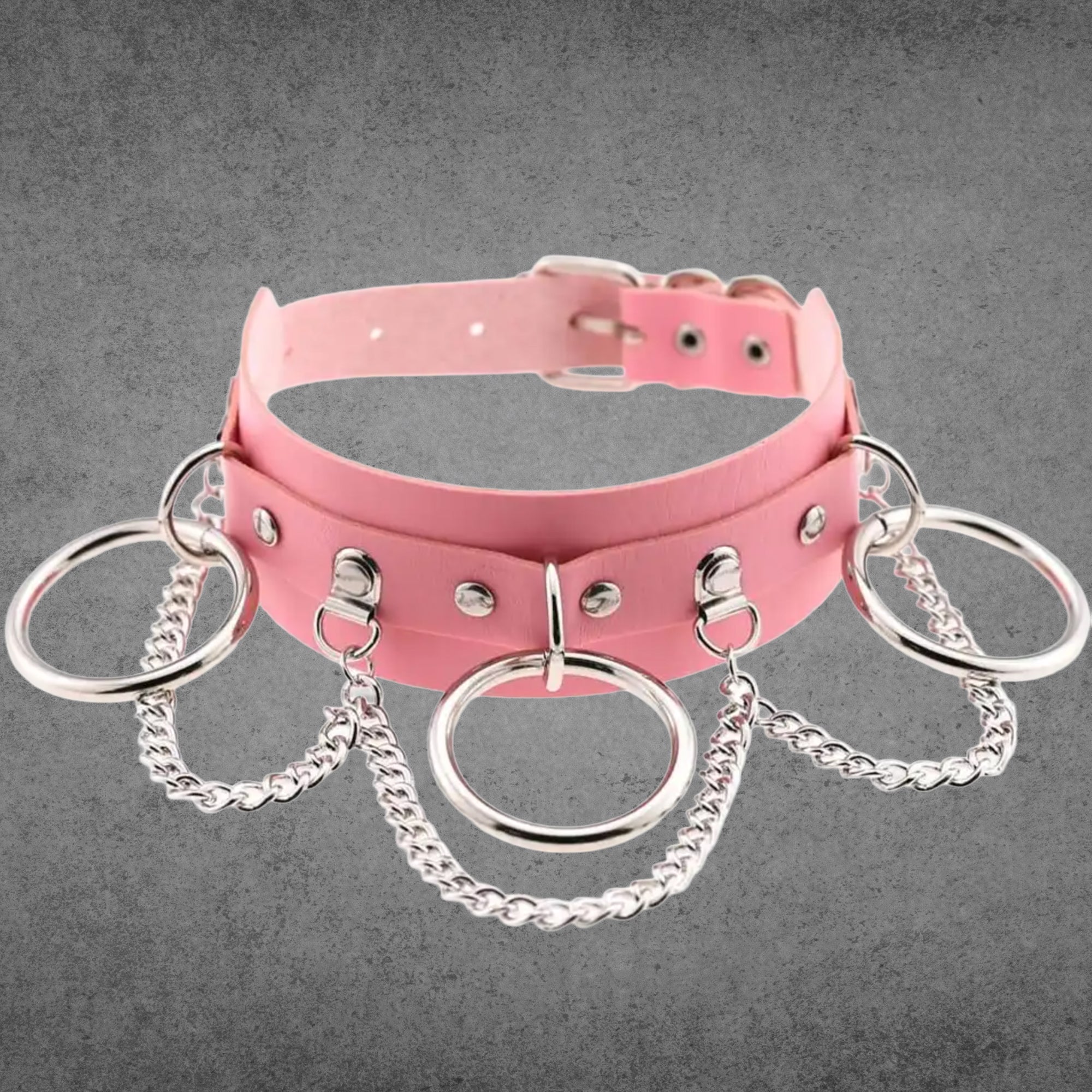 Baby pink faux leather collar with three silver O-rings linked by chains
