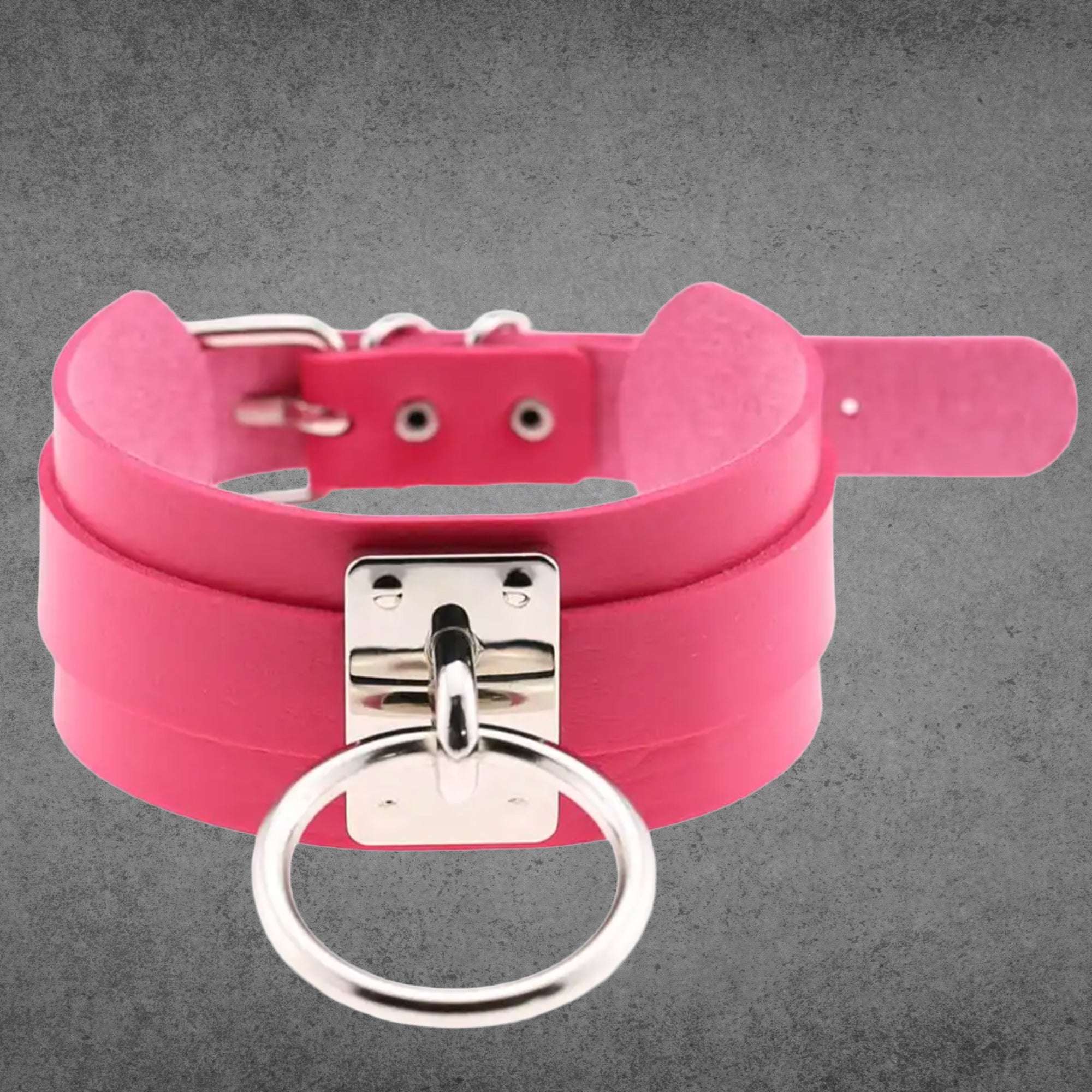 Hot pink faux leather collar with a large silver O-ring centrepiece
