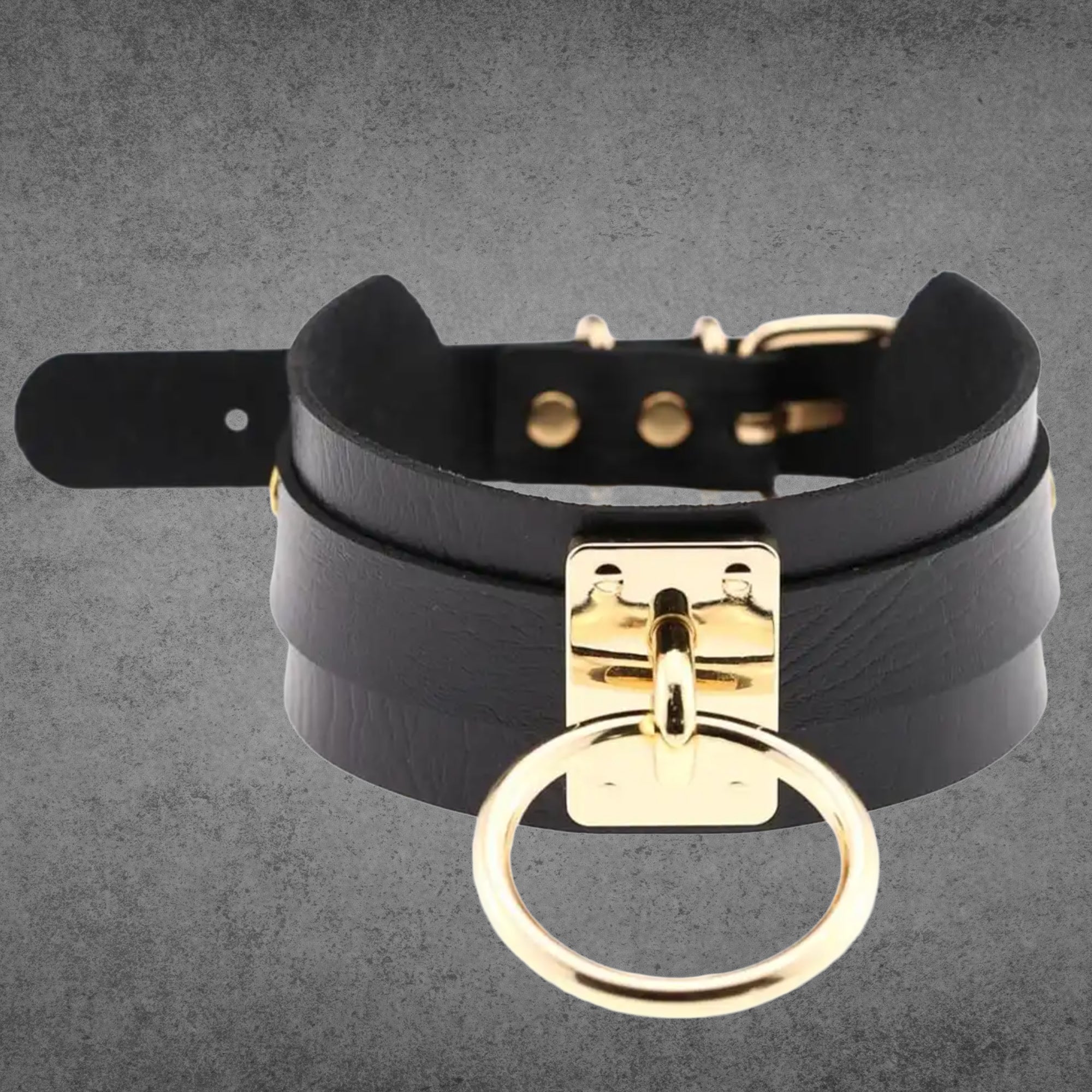 Black faux leather collar with a large gold O-ring centrepiece