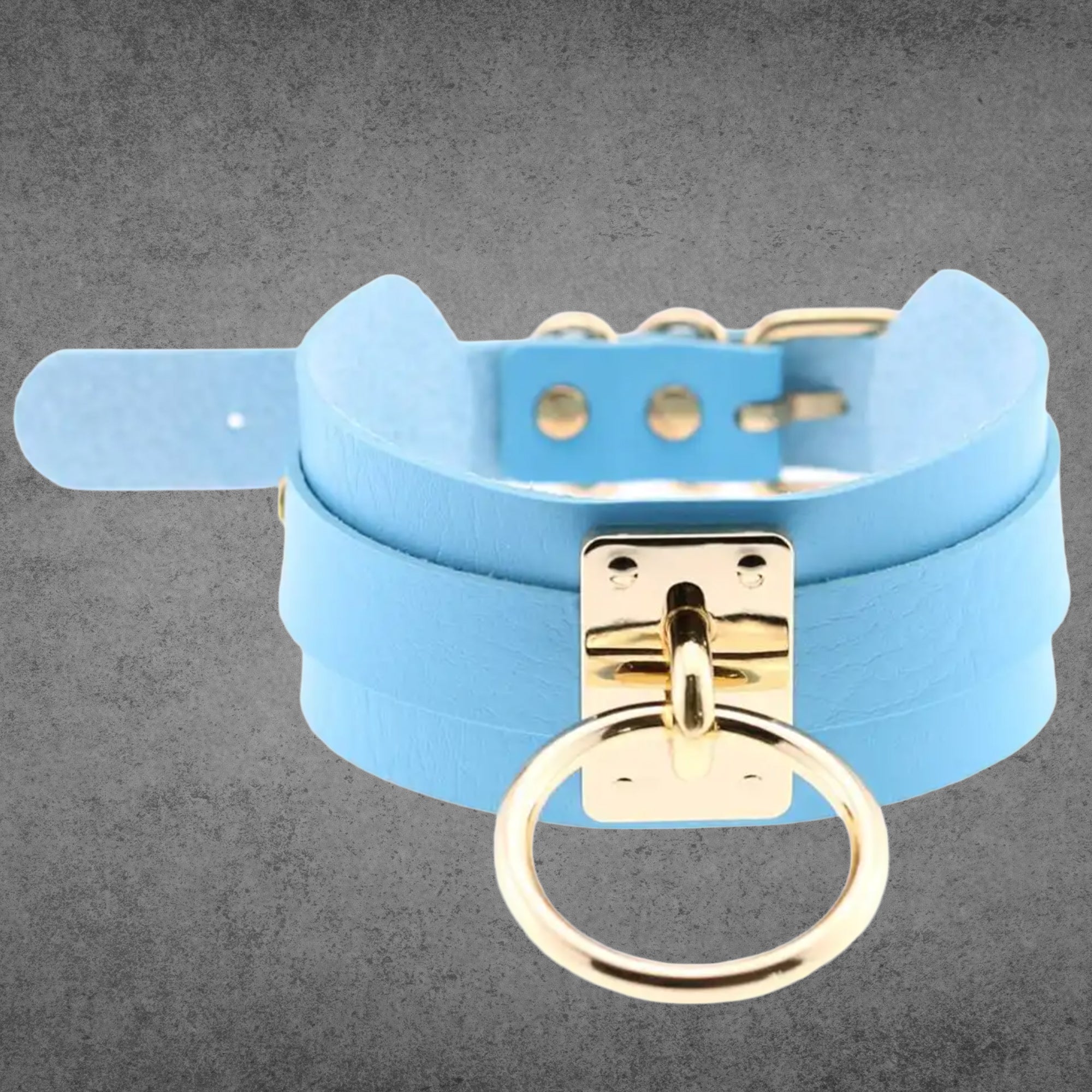 Baby blue faux leather collar with a large gold O-ring centrepiece