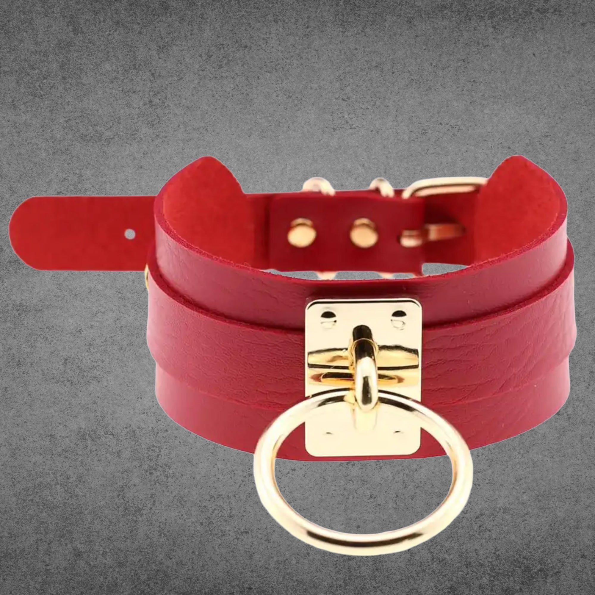 Red faux leather collar with a large gold O-ring centrepiece