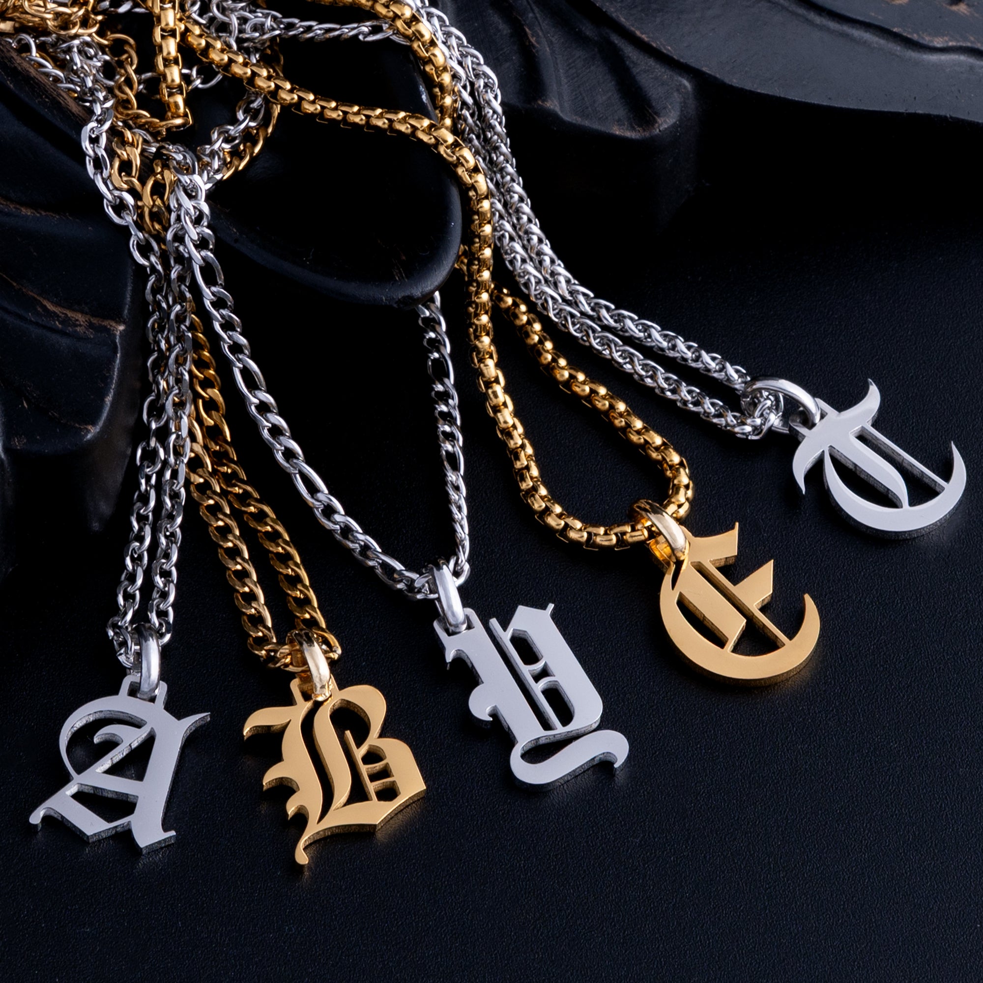 Mixed selection of initial pendant necklaces in Gold and Silver
