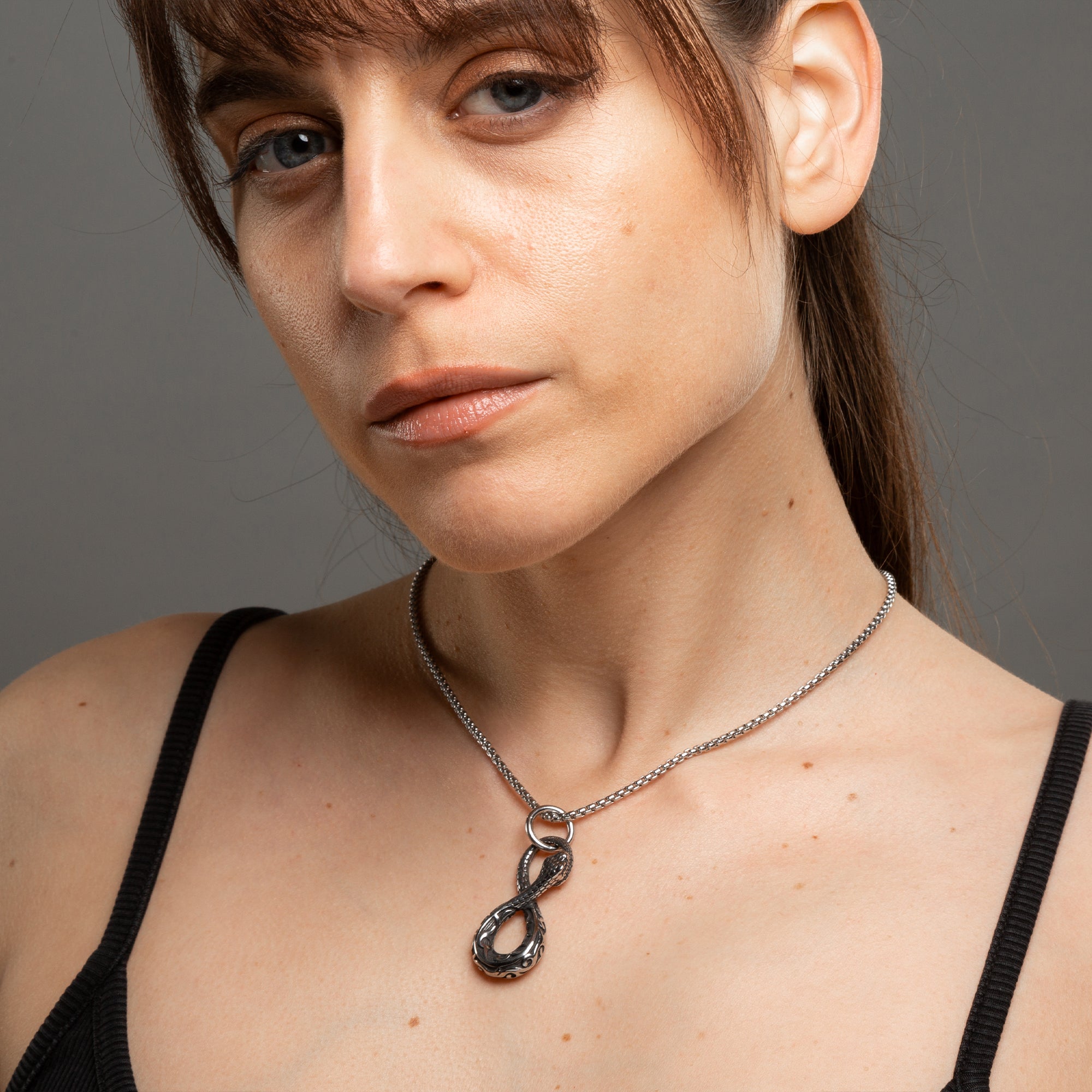snake pendant on a dainty box chain necklace