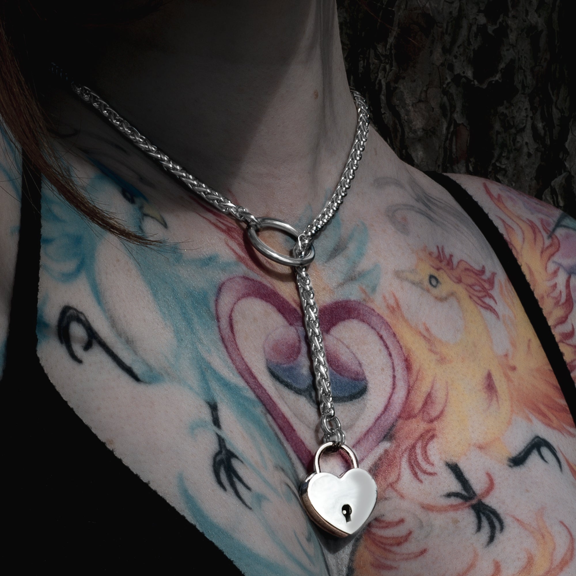 Silver coloured foxtail slip chain with heart shaped padlock