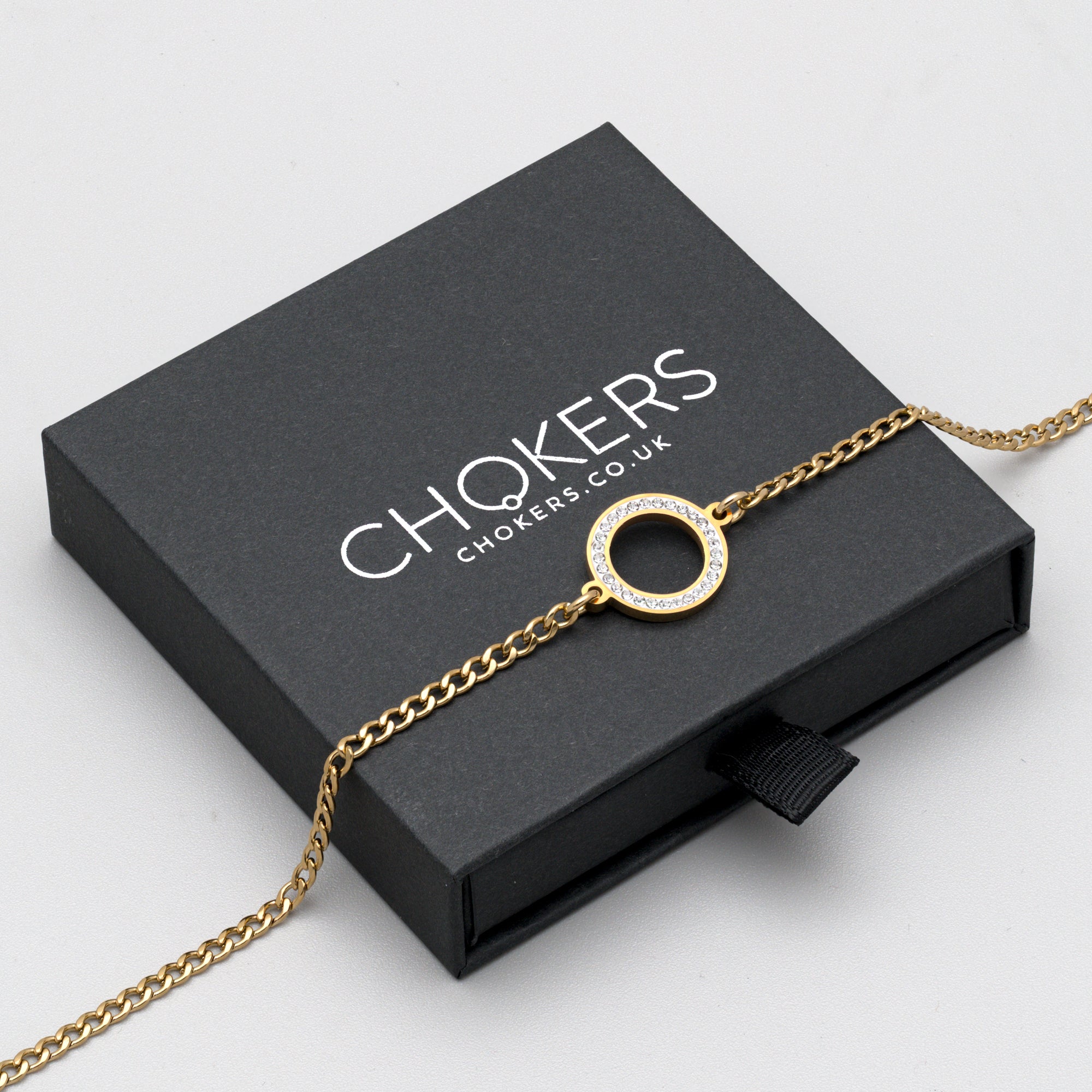 Gold gemstone encrusted O Ring day collar choker
