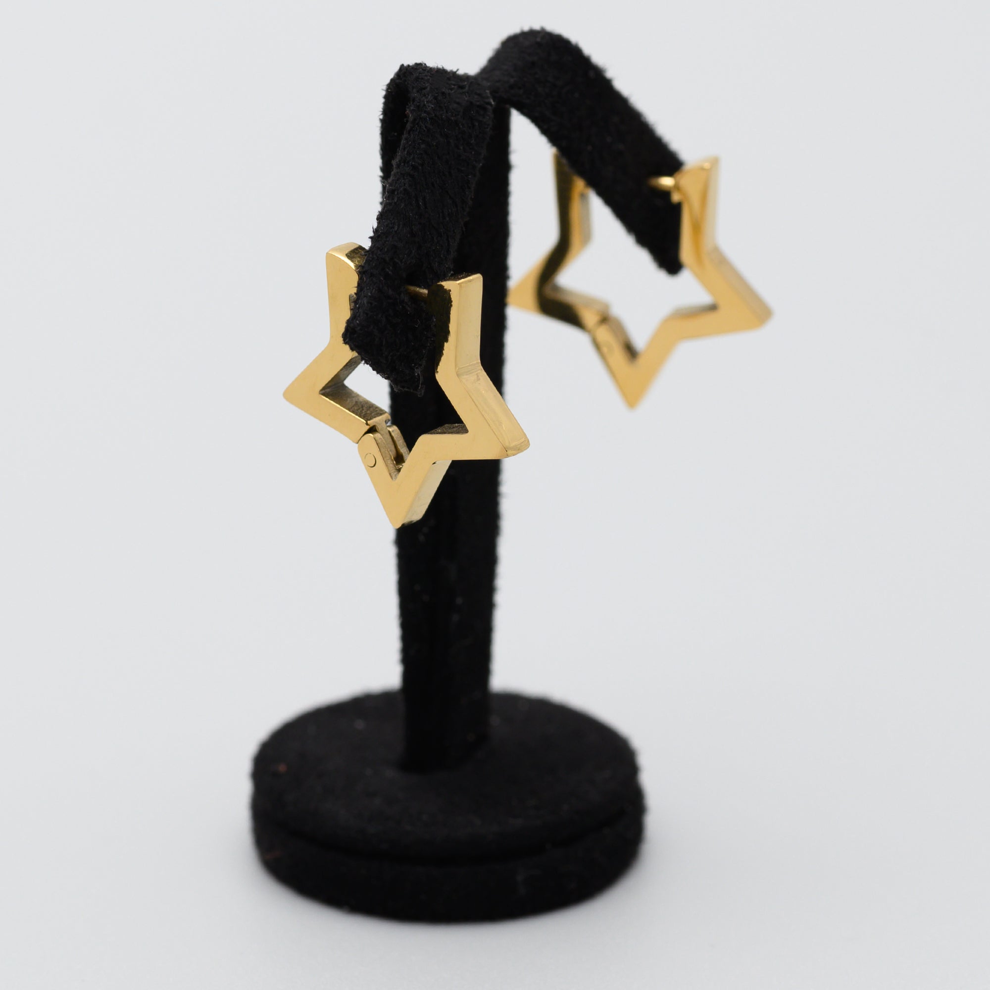 Gold star shaped hinged huggie hoop earrings