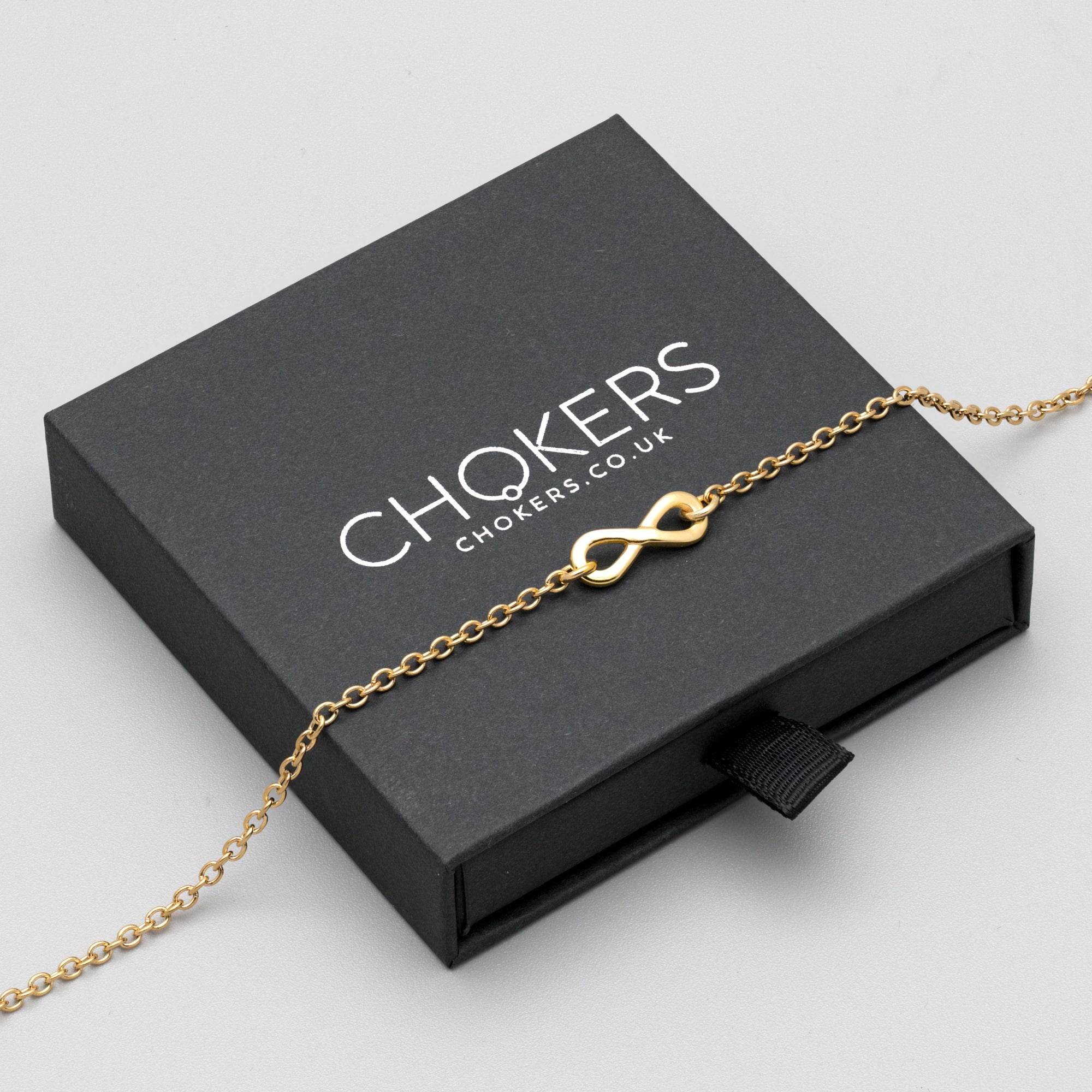Gold Infinity symbol day collar necklace on dainty cable chain