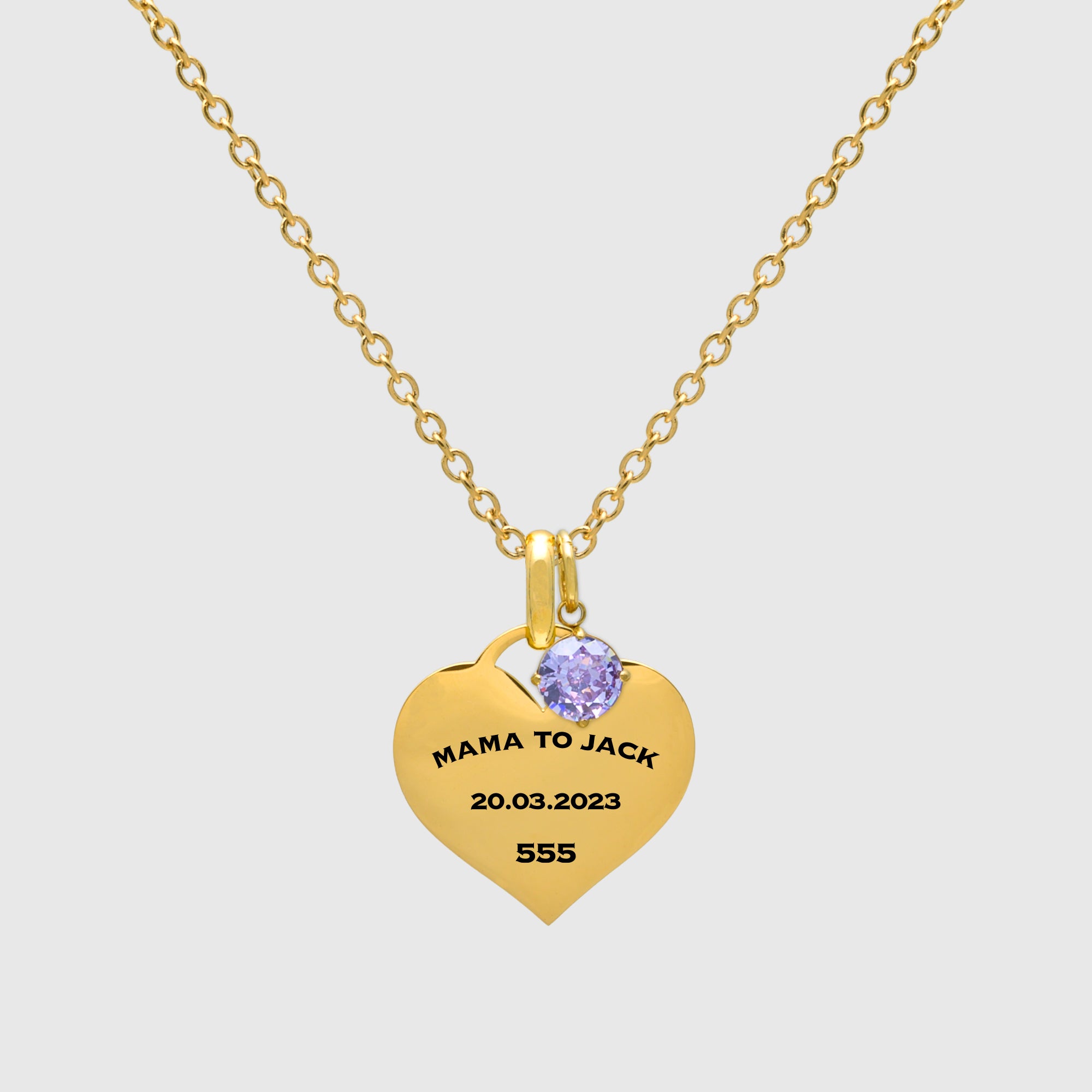 Gold heart shaped pendant necklace with a birthstone on a dainty chain