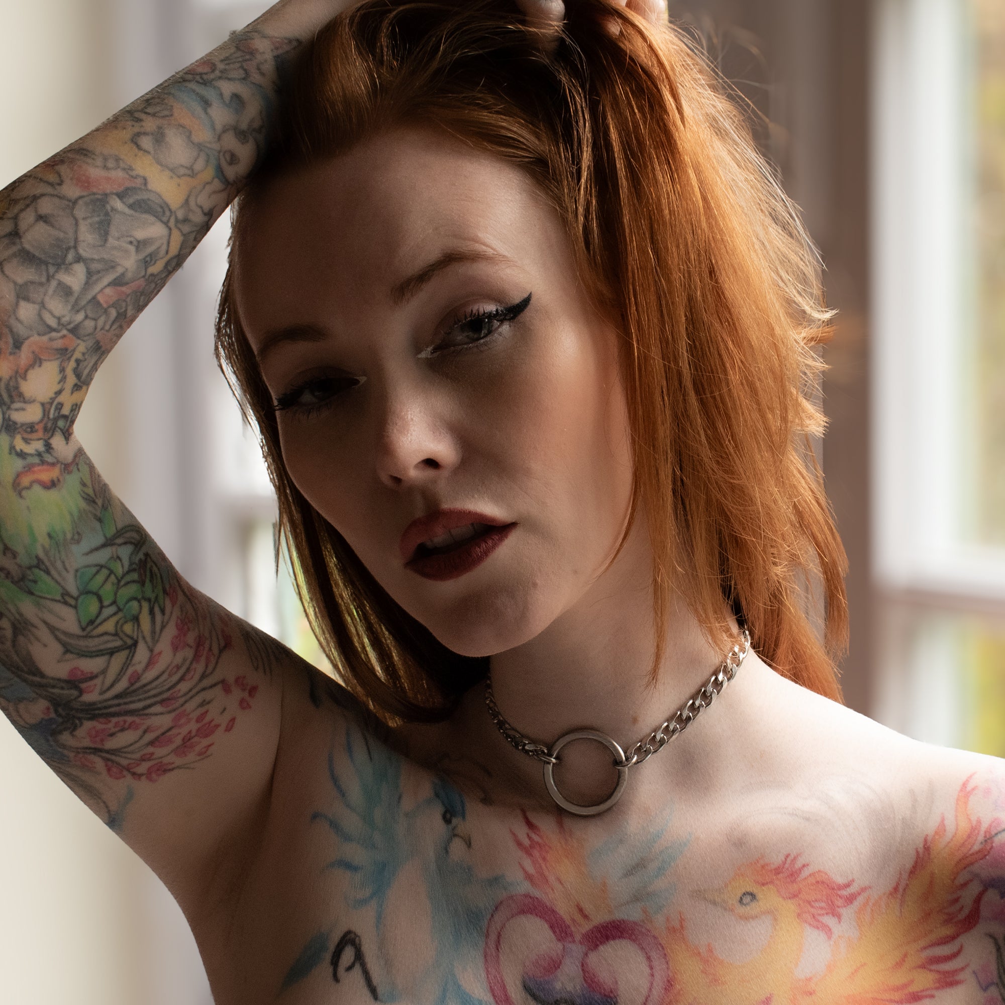 Close up of Model wearing a silver chunky O Ring day collar