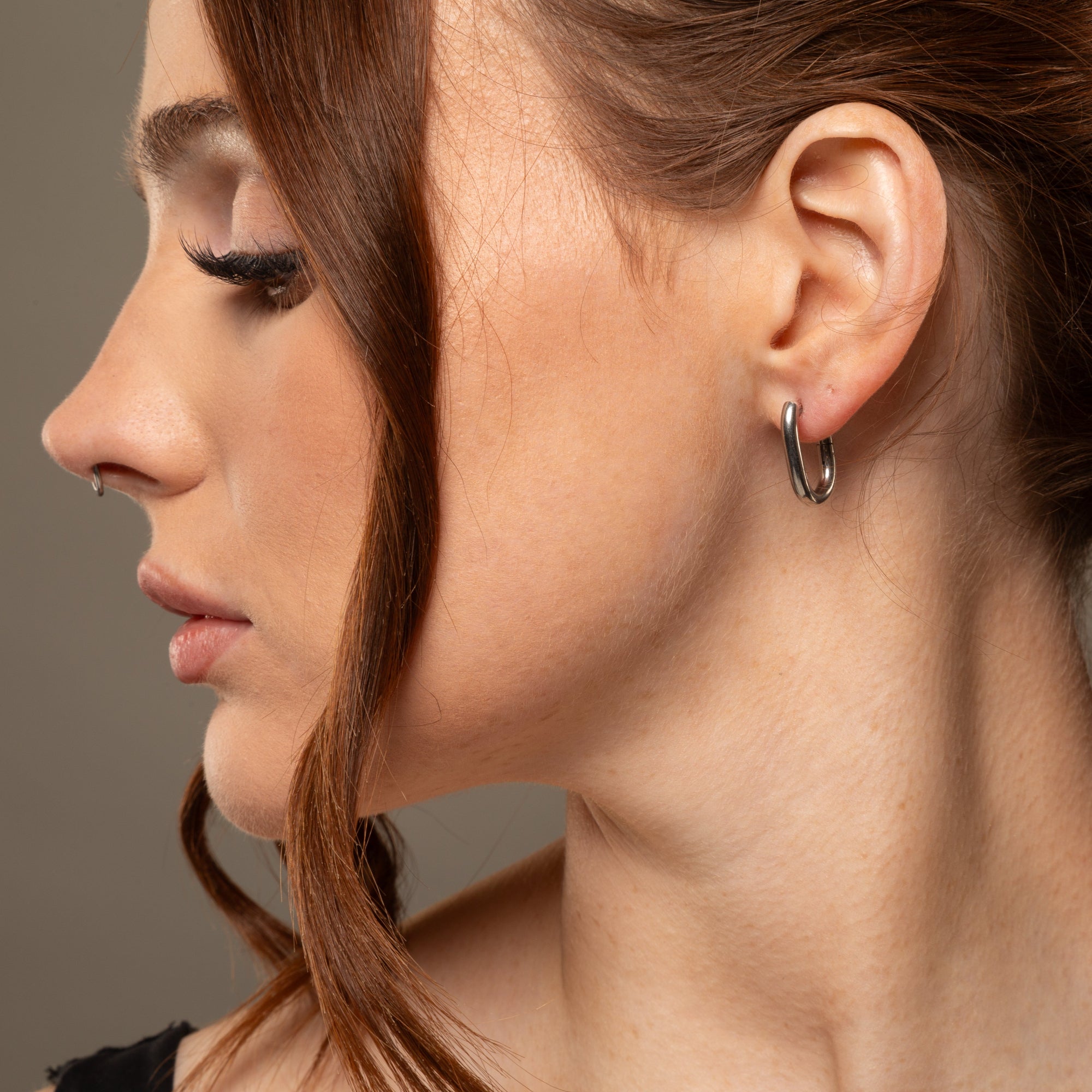 Oval huggie hoop earrings in silver