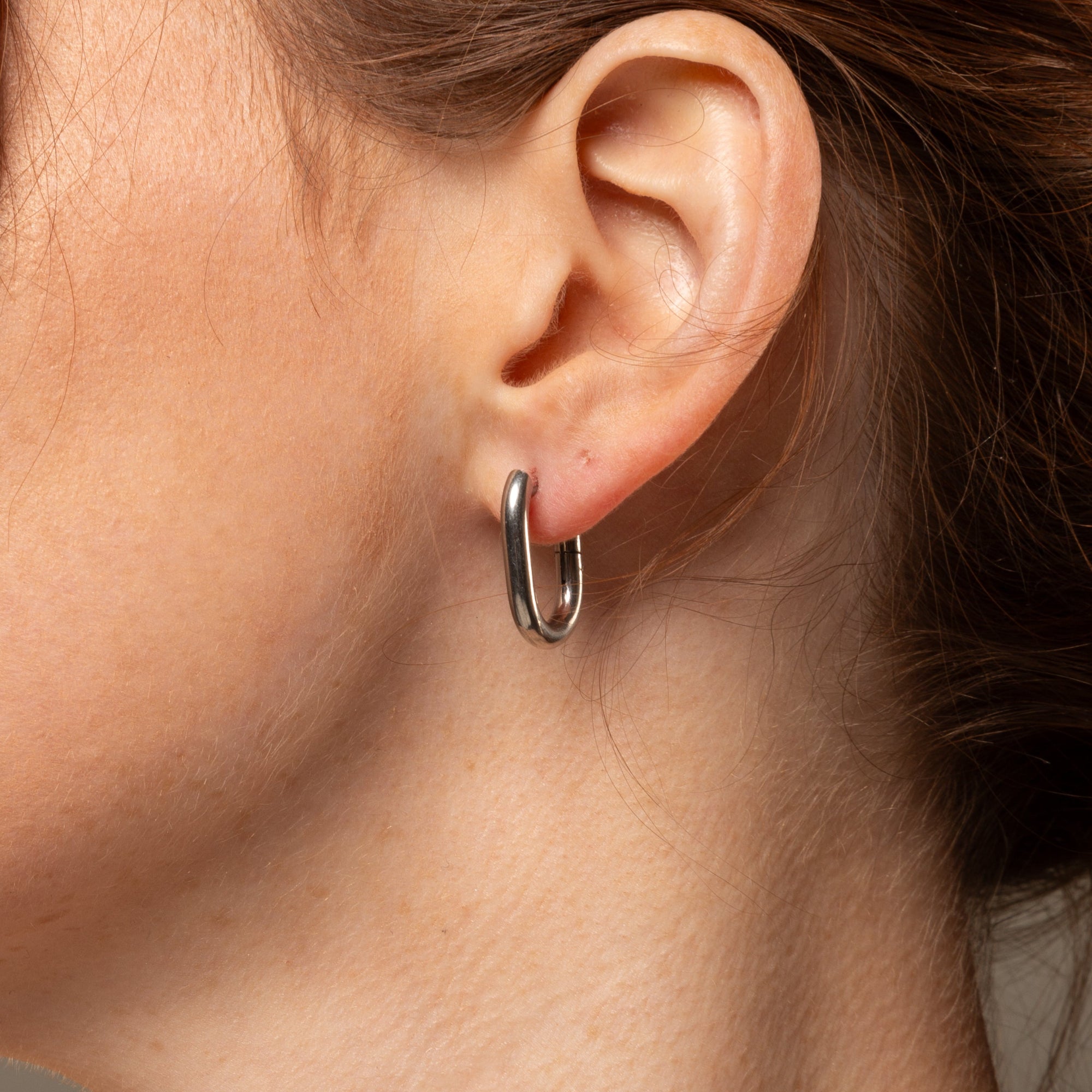Oval huggie hoop earrings in silver