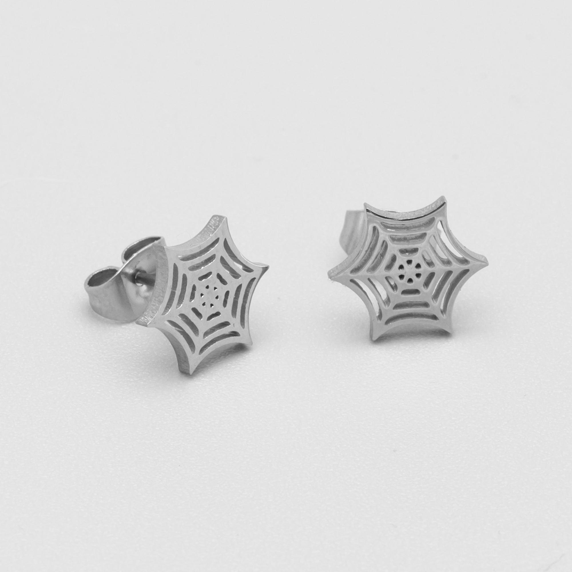 Small cobweb style stud earrings in silver