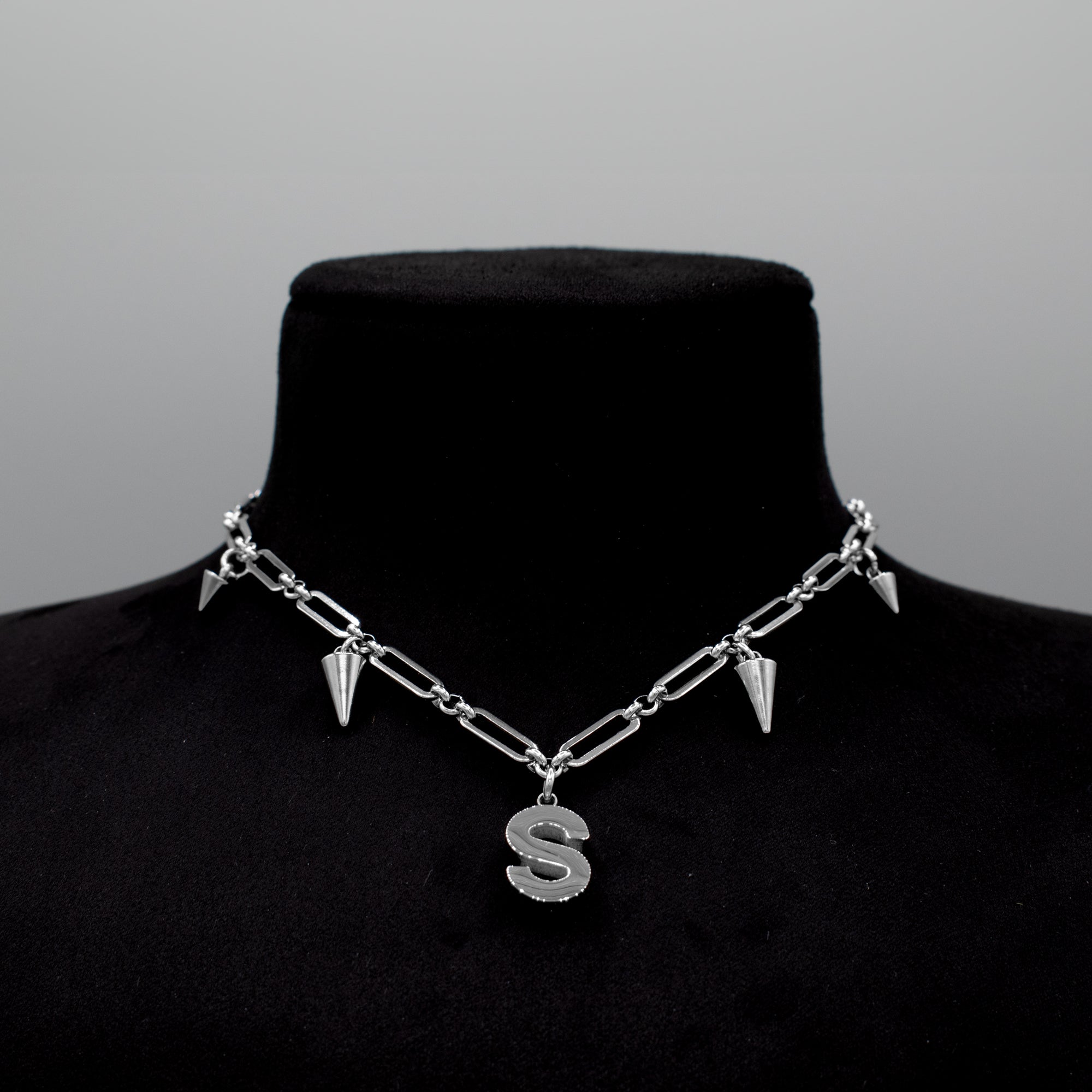 bold initial spiked choker necklace close up