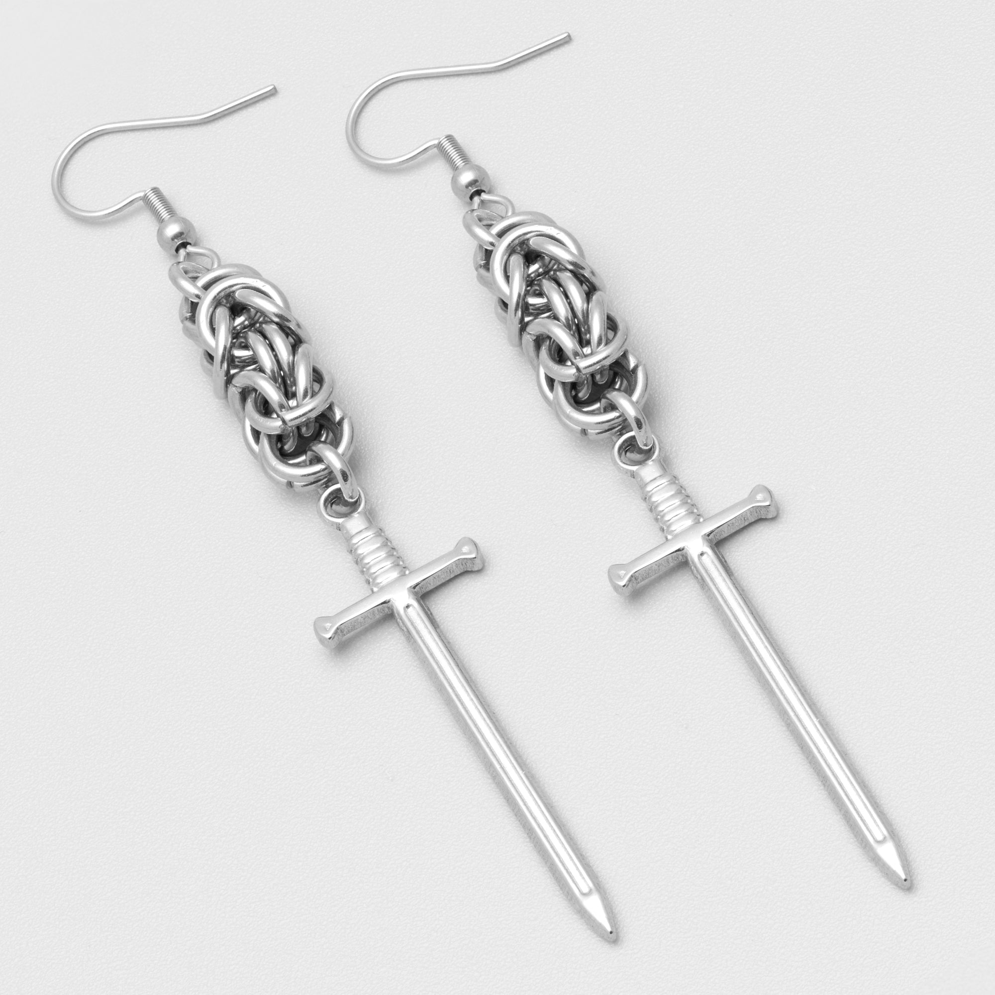 Medieval Gothic sword drop earrings in silver, featuring a byzantine chainmail design