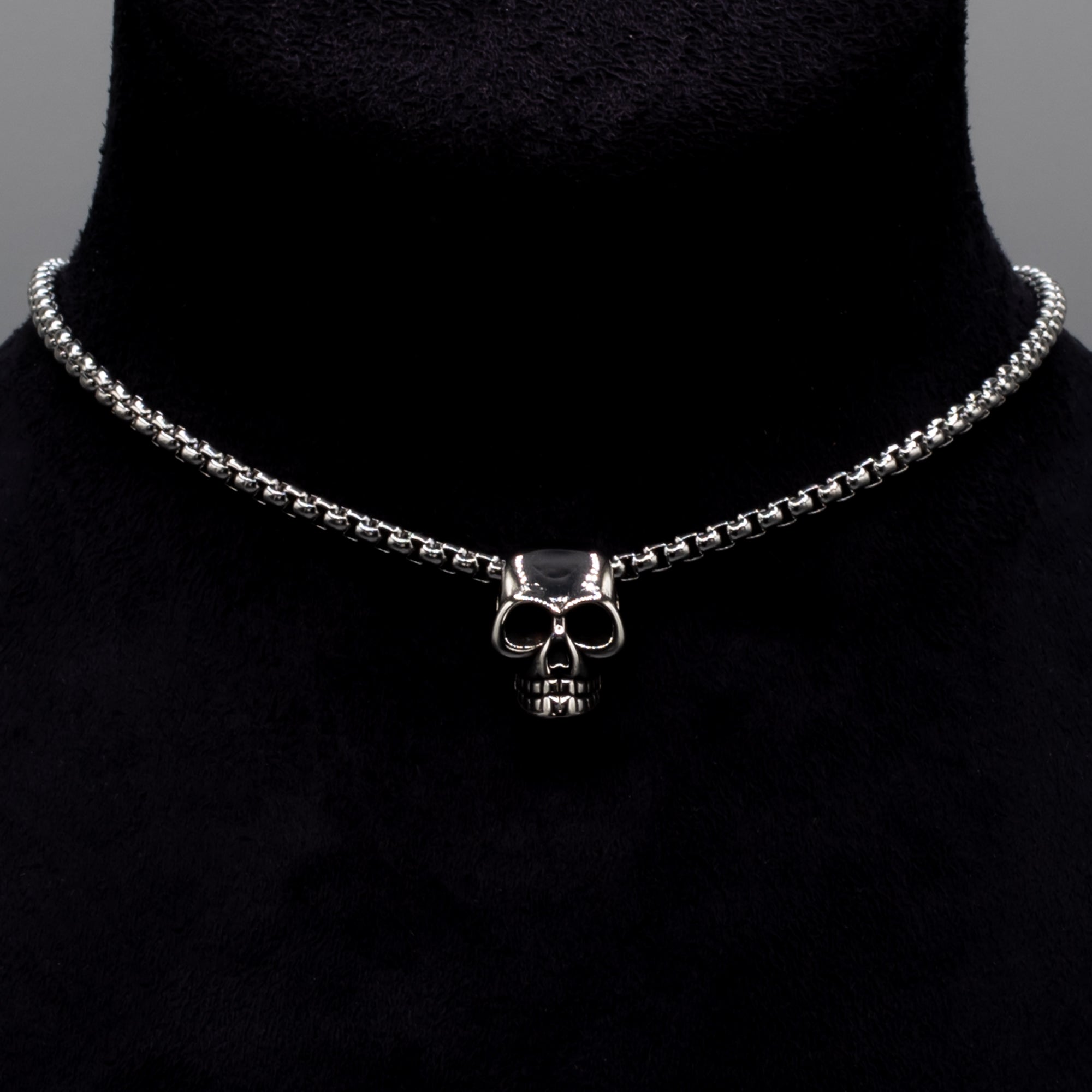 A gothic skull pendant on chunky box chain