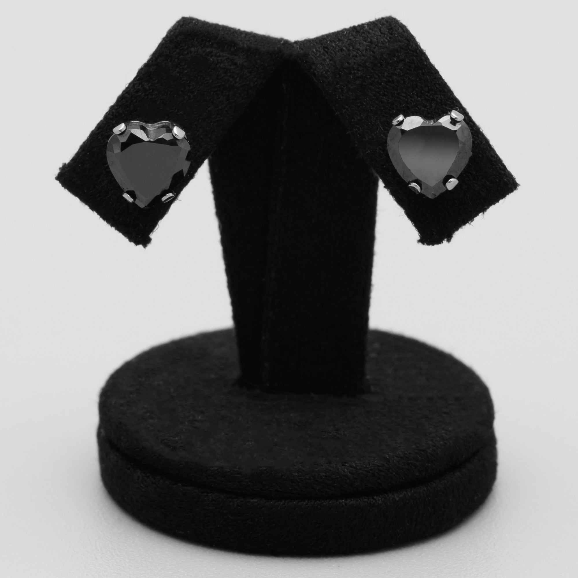 Close up of black heart CZ stud earrings 