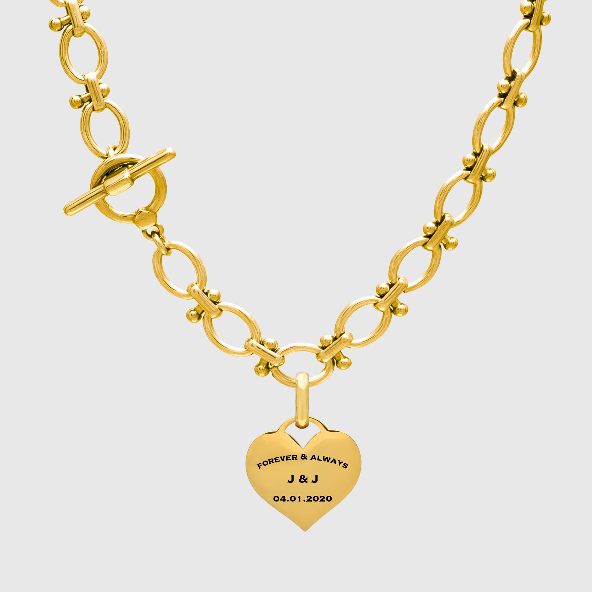 Engraved Gold heart pendant on chunky necklace 