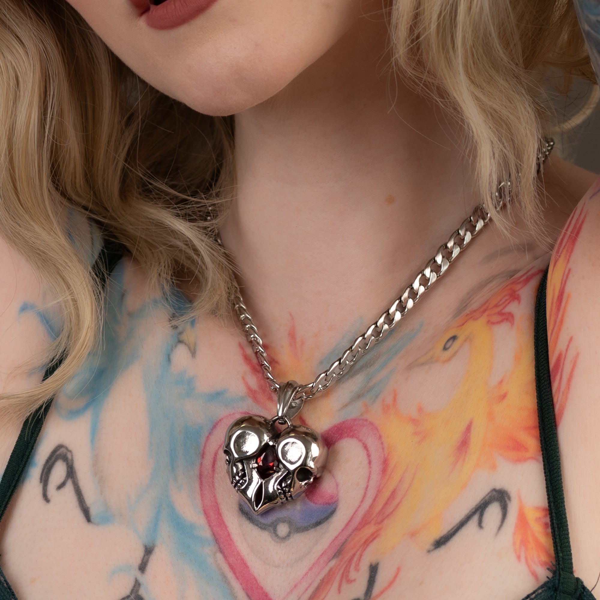 Double skull heart pendant on chunky cuban choker chain