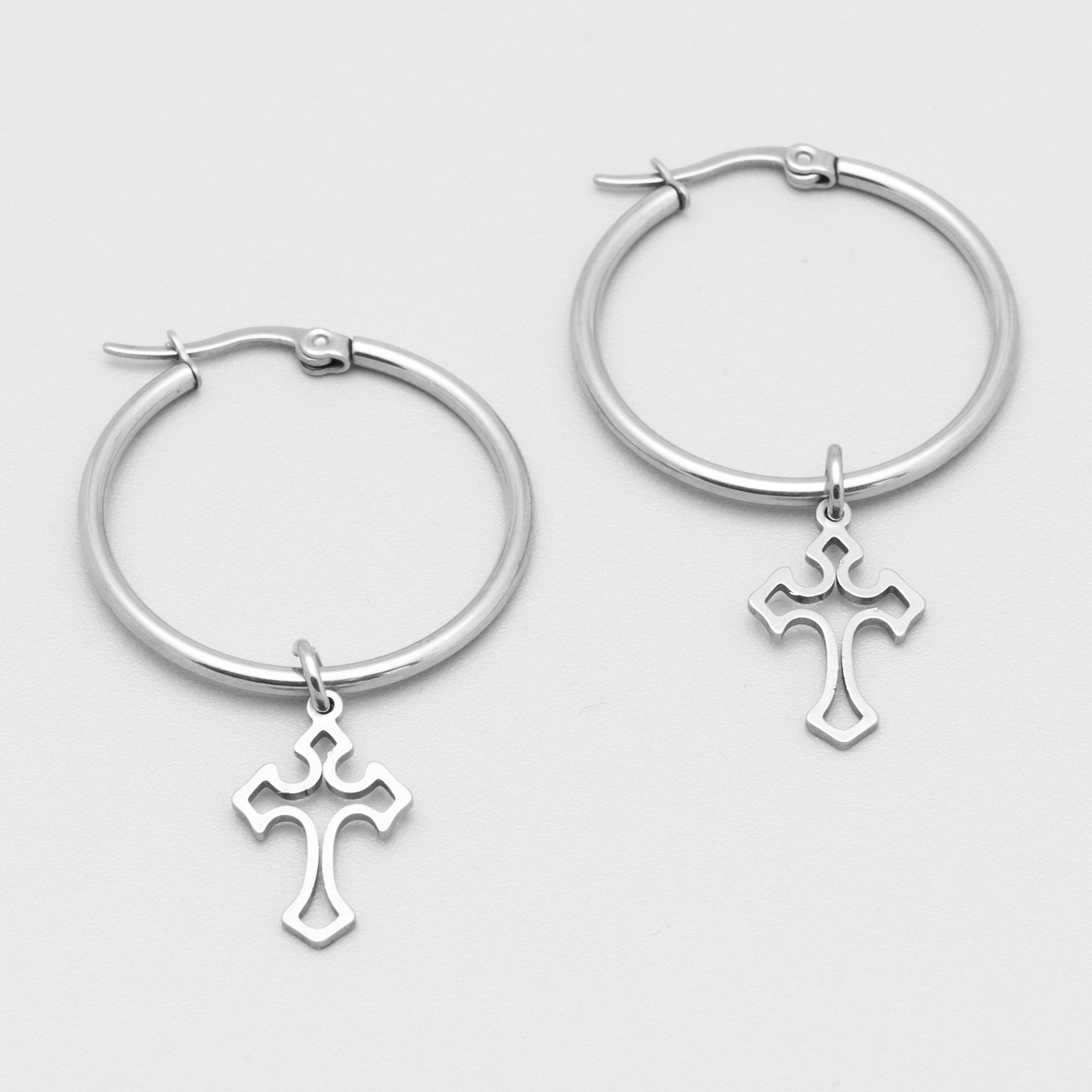 Large gothic cross hoop earrings in silver featuring single gothic cross charms