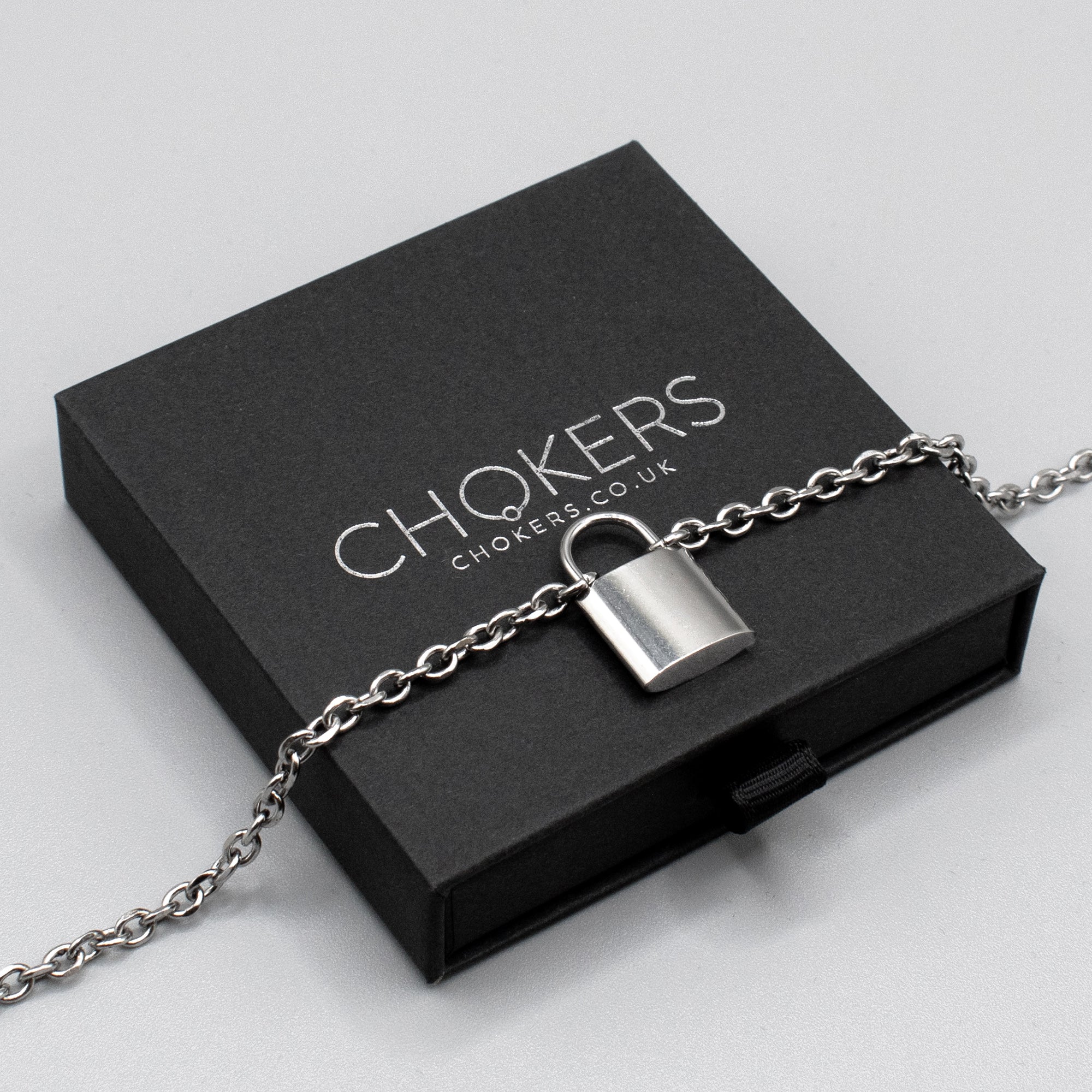 A day collar made up from a 25mm stainless steel padlock Pendant on 4mm stainless steel cable chain