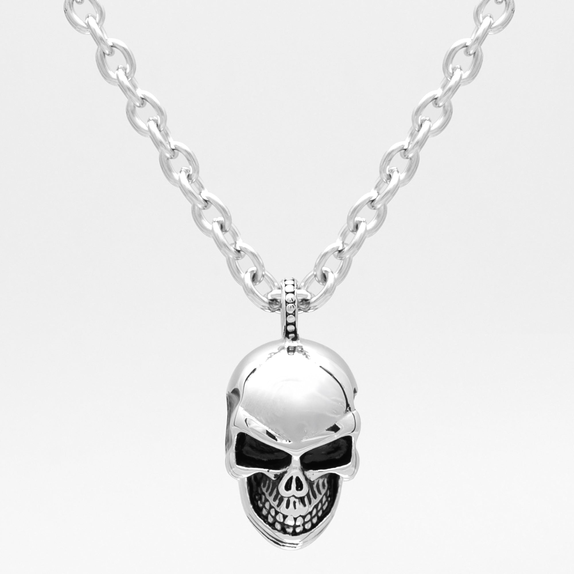 Large silver anatomical skull pendant on a chunky cable chain necklace