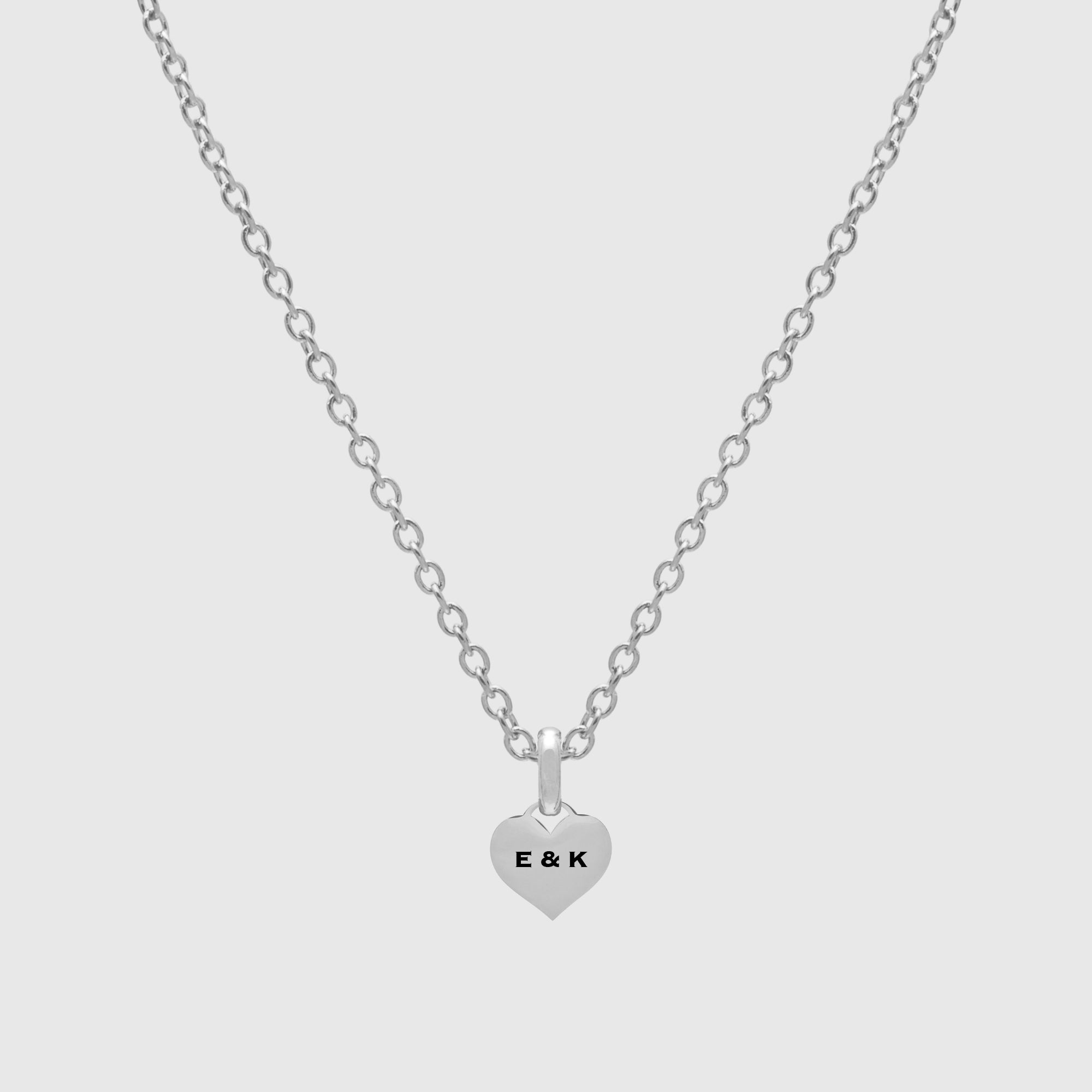 Mini engraved heart pendant necklace in silver, engraved with initials 