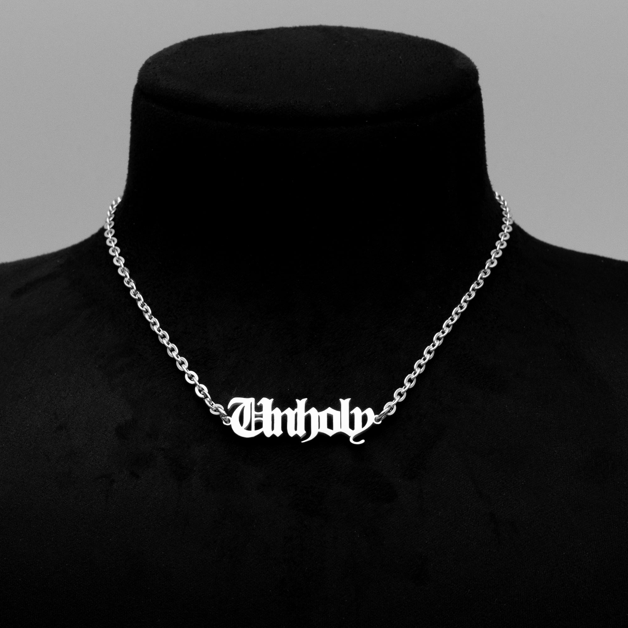 Gothic font Unholy word pendant on silver cable chain