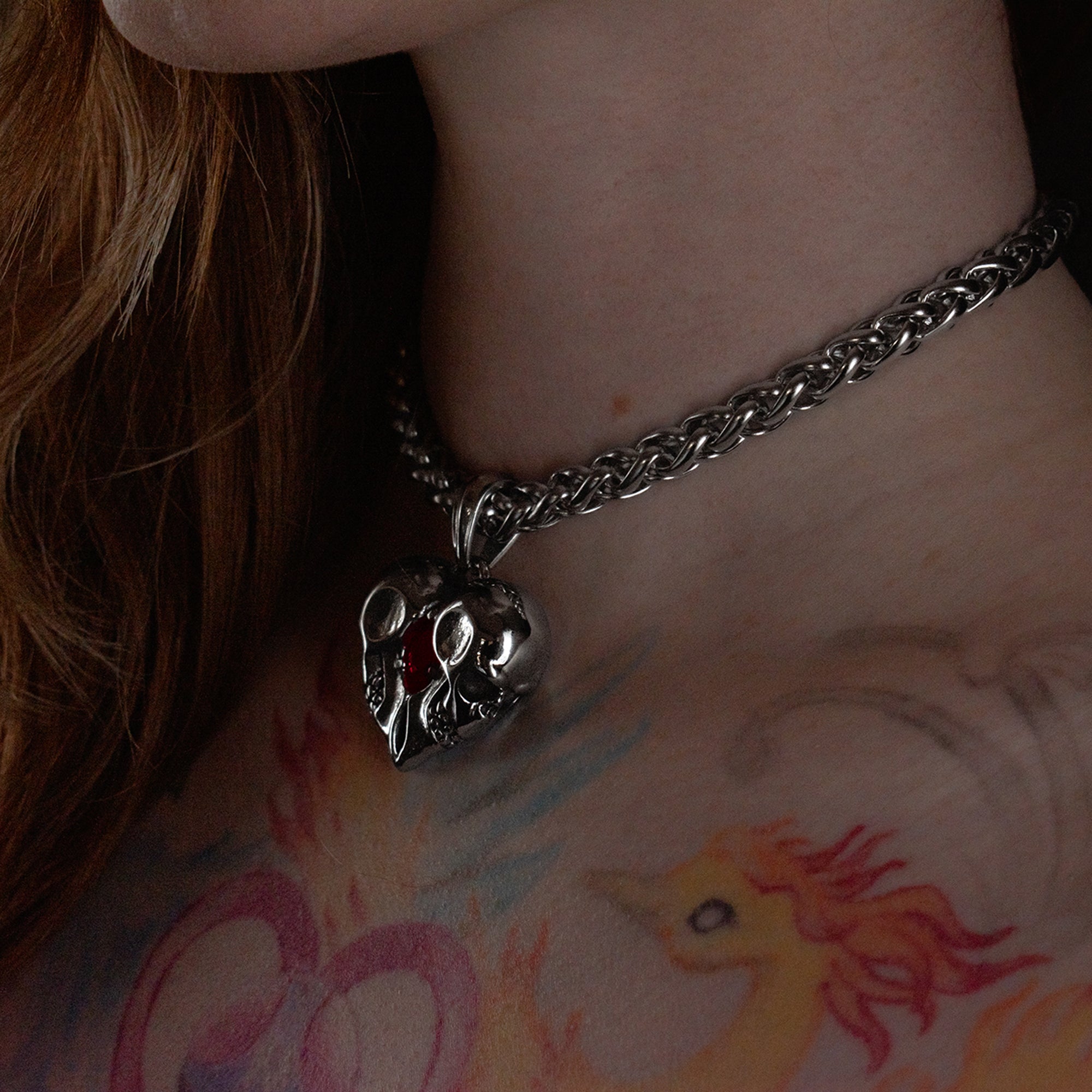 Eternal Love Double skull choker in solid stainless steel, featuring a large single red, precious looking stone 